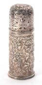 Victorian silver sugar caster of cylindrical form with pierced screw on lid, the body embossed