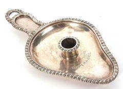 A Victorian silver chamber stick of pear shape, applied gadrooned rim and handle, engraved to the
