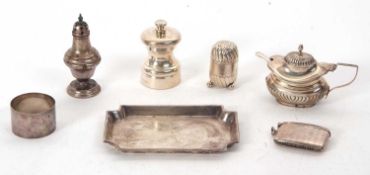 Mixed Lot: A small hallmarked silver tray of plain rectangular form with cantered corners,