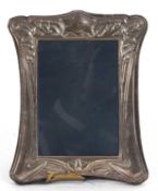 Modern silver photograph frame in Art Nouveau style, shaped rectangular form, easel backed,