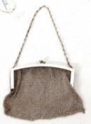 Ladies meshwork evening bag, the frame engraved one side withan engine turned design, suspended from