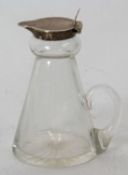 A George VI silver whisky noggin having silver flip top lid and mounted pourer, plain glass body and