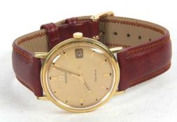 An Omega Geneve gents wristwatch, it has a manually crown wound movement and gold coloured dial with
