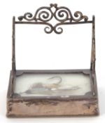 An early 20th Century silver framed desk pen holder paperweight with a glazed panel with a fly