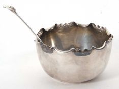 An Edwardian silver sugar bowl of plain round form having a crimped edge, hallmarked for Sheffield