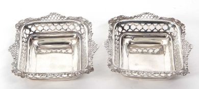 Two Victorian silver shallow dishes of rectangular form with pierced geometric design borders and