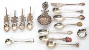 Mixed Lot: A Dutch white metal decorative caddy spoon, the round shaped bowl embossed with figure