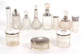 Mixed Lot: Glass dressing table jars, hair tidies and scent bottles, each with hallmarked silver