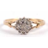 A 9ct diamond cluster ring, the tiered cluster set with small round diamonds, total 0.10cts, with