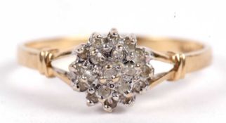 A 9ct diamond cluster ring, the tiered cluster set with small round diamonds, total 0.10cts, with