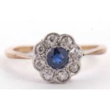 An 18ct sapphire and diamond ring, the central round sapphire surrounded by single cut diamonds, all