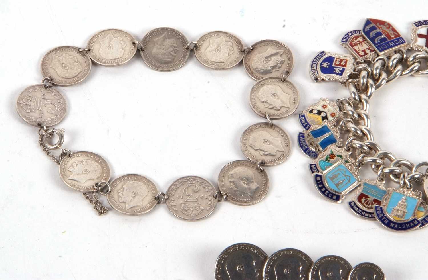 A threepence coin bracelet and a coin brooch, 23g, together with a silver and enamel charm bracelet, - Image 2 of 4