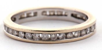 A diamond eternity ring, with channel set round brilliant cut diamonds, total estimated approx. 0.