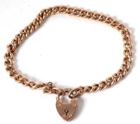 A 9ct curblink bracelet, with heart shaped padlock clasp, both stamped 9ct, 18cm long, 8.1g