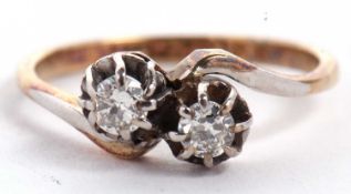 An 18ct and platinum two stone 'toi et moi' diamond ring, the two round brilliant cut diamonds,