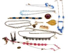 A quantity of costume jewellery to include diamante necklaces, bead necklaces, a faux amethsyt