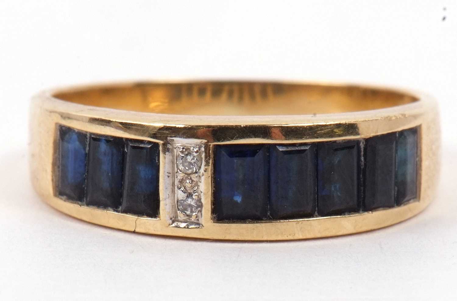 An 18ct sapphire and diamond ring, the channel set sapphires, offset with two small round - Image 2 of 9