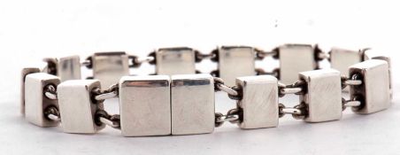 A silver bracelet stamped 'Gucci', the solid rectangular links, approx. 9mm wide, separated by
