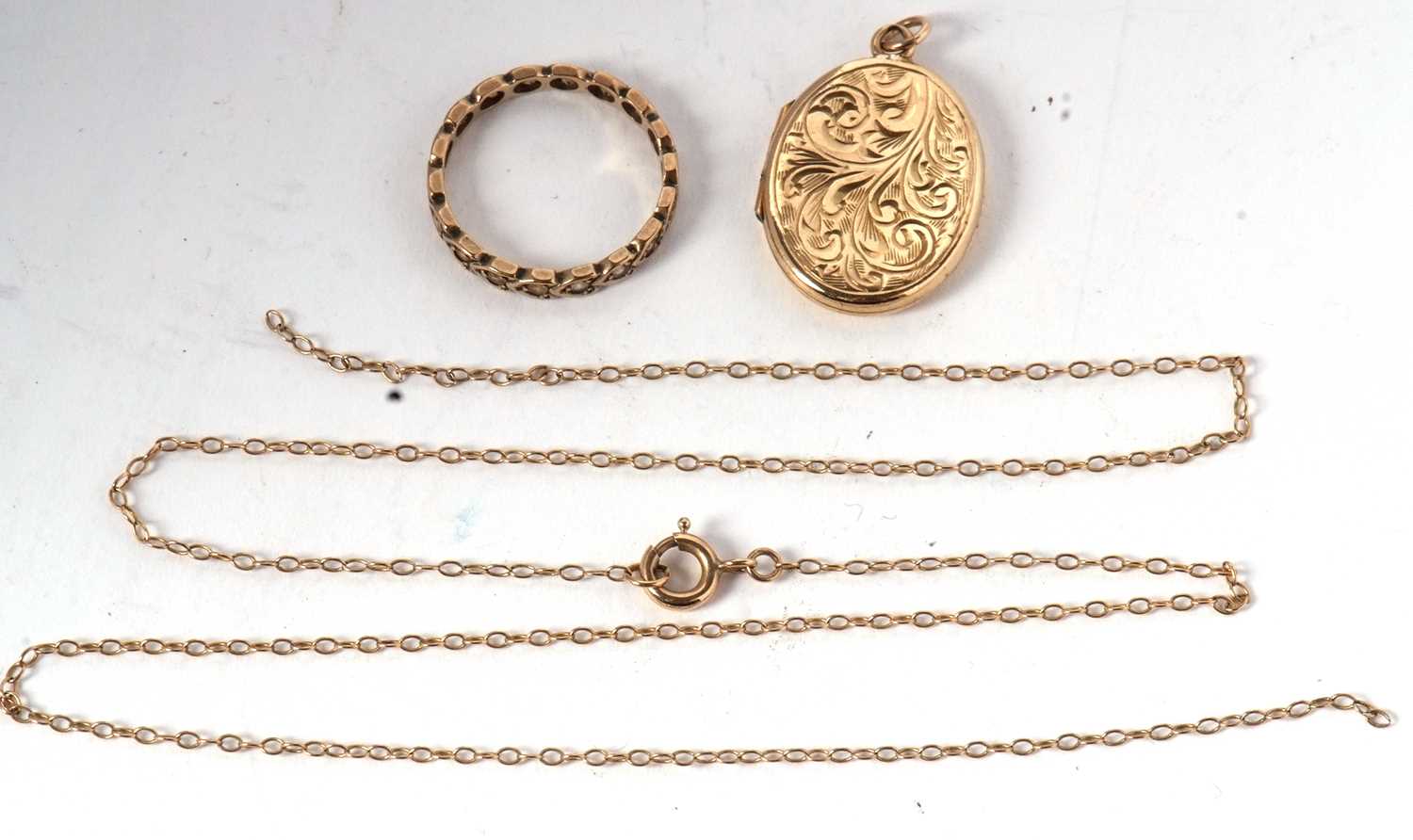 A 9ct oval locket, 3.4g, with fine unmarked yellow metal chain (a/f). together with a white stone