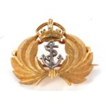 A 15ct Royal Navy brooch, the white metal anchor set to centre and surrounded by feathers and