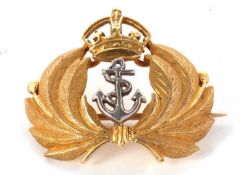 A 15ct Royal Navy brooch, the white metal anchor set to centre and surrounded by feathers and