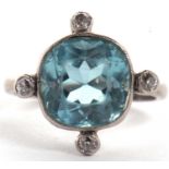 An aquamarine and diamond ring, the squared mixed cut aquamarine set with a small round diamond to