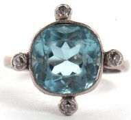 An aquamarine and diamond ring, the squared mixed cut aquamarine set with a small round diamond to