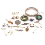 Mixed lot: a quantity of silver and white metal jewellery to include a hinged bangle, Arts and