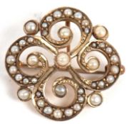A 9ct split pearl brooch/pendant, the quatrefoil shaped brooch set throughout with graduated split
