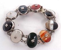 An agate speciment bracelet, the oval agate specimens, each collet mounted and set to centre with