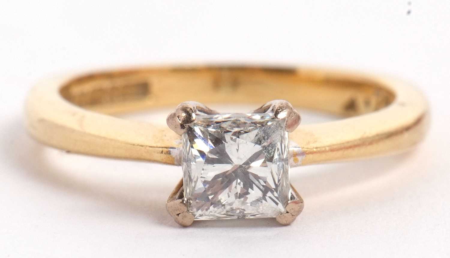 An 18ct princess cut diamond ring, wieght approx. 0.75cts, in a four claw mount to a plain band - Image 11 of 11