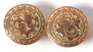A pair of late Victorian 9ct buttons/studs, the round discs with engraved decoration, hallmarked