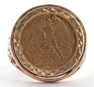 A 9ct 1/4 ounce coin mounted ring, set with a 1986 1/4oz Angel coin, in faceted rubover mount,