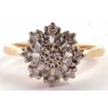 An 18ct three tier diamond cluster ring, set with round brilliant cut diamonds, all in white metal