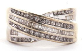 A diamond crossover ring, set with three crossover bands of alternating small round diamonds and