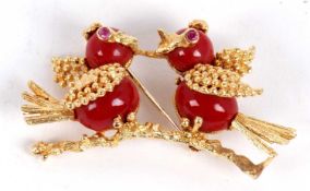 An 18ct bird brooch, the two birds sat on a branch, comprised of red jasper bodies set with red