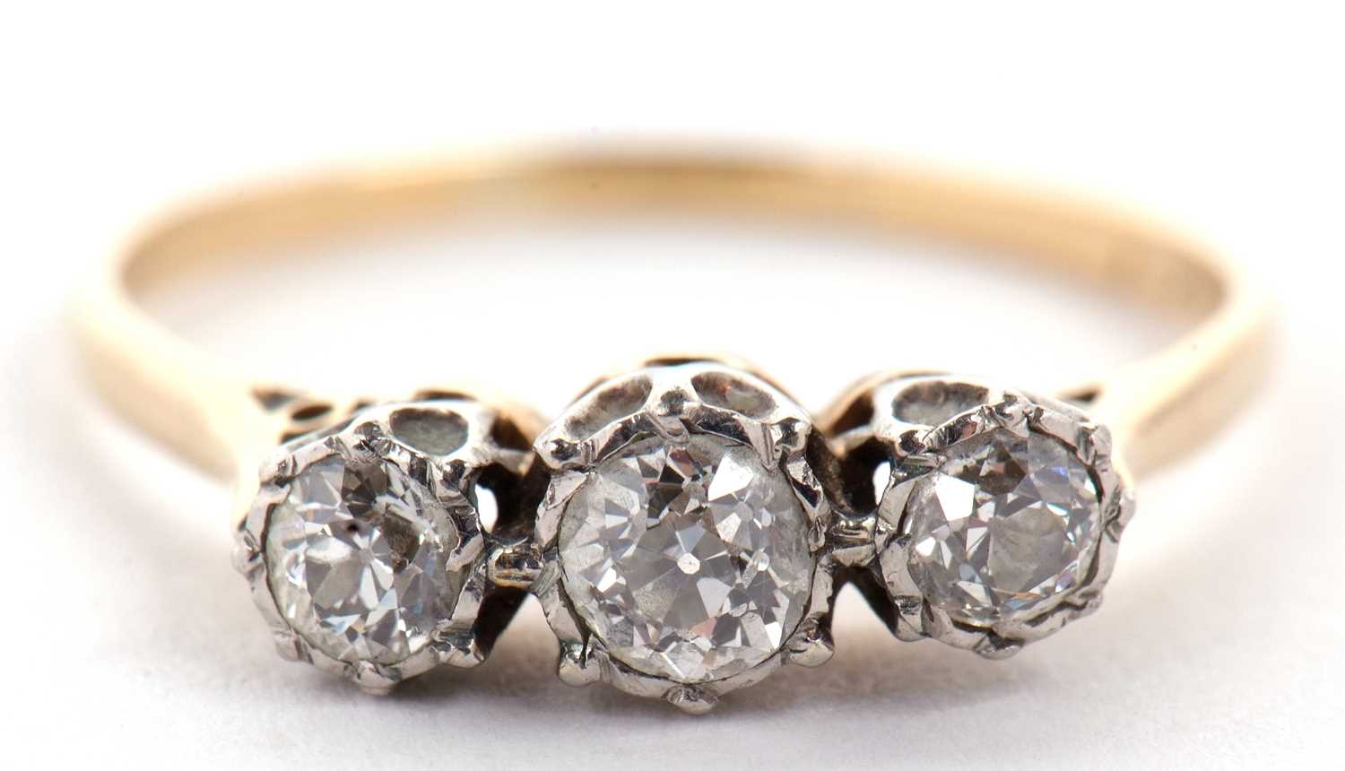 A platinum and 18ct three stone diamond ring, the three slightly graduated old cut diamonds in - Image 2 of 9