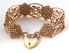 A 9ct fancy link bracelet, with plain and textured links, with jump ring stamped 9ct, with heart