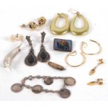 A quantity of mixed costume jewellery to include a silver leaf brooch, a coin bracelet, marcasite,