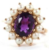 A 9ct amethyst and split pearl ring, the oval amethyst surrounded by split pearls, overall 16.8mm