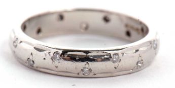 A platinum diamond eternity ring, the 3.8mm wide band set with small, single cut diamonds, stamped