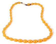 A butterscotch amber bead necklace, the graduated beads, between 6mm - 11mm, with unmarked yellow