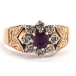 A 9ct amethyst and diamond ring, the central round amethyst, surrounded by illusion set diamonds,