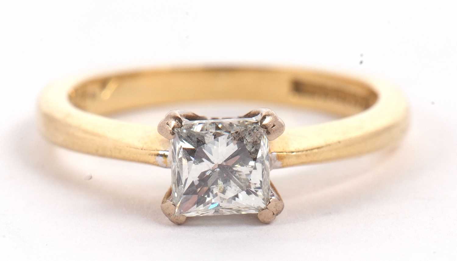 An 18ct princess cut diamond ring, wieght approx. 0.75cts, in a four claw mount to a plain band - Image 2 of 11