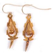 A pair of Archeological Revival earring, the pear shape drop with bead decoration, set within an