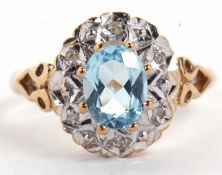 A 9ct topaz and diamond ring, the oval blue topaz claw mounted and surrounded by illusion set