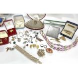 A quantity of costume jewellery to include faux pearls, silver locket and chain, rolled gold