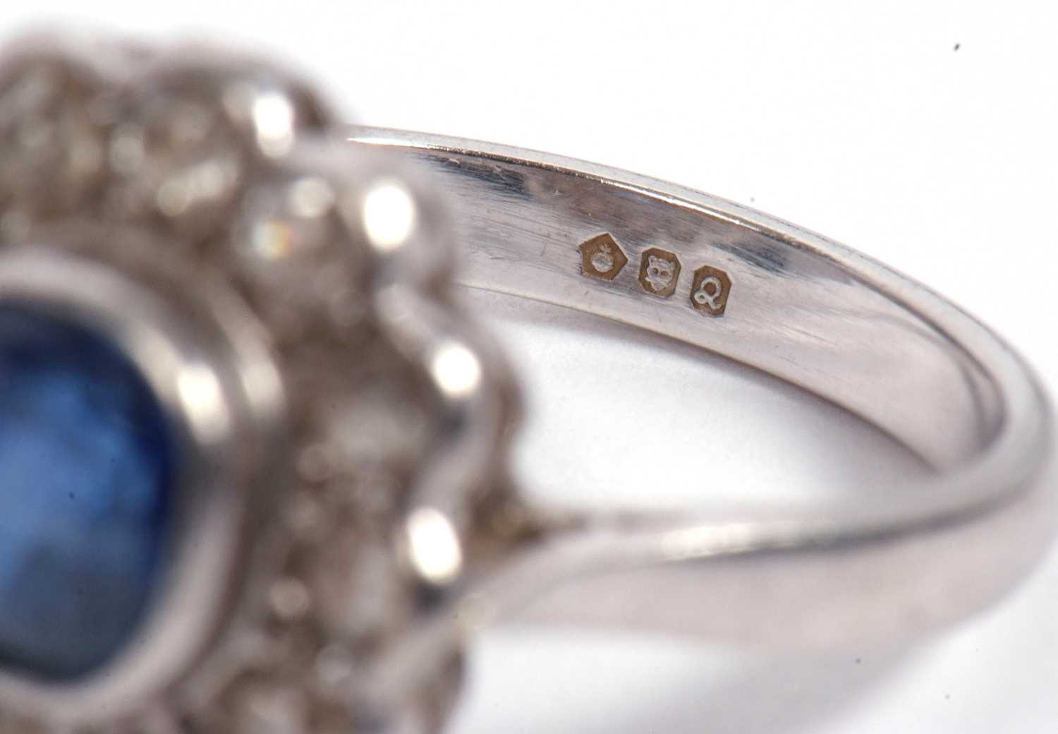 A sapphire and diamond cluster ring, the cushion shaped faceted sapphire is 7x7x4mm approx, bezel - Image 10 of 11
