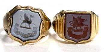 An 18ct intaglio ring and another similar, the first with shield shape agate intaglio, with