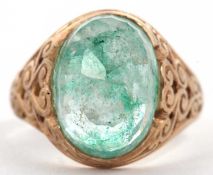 A 9ct gentleman's gemset ring, set with a pale green dyed faceted quartz cabochon, collet mounted